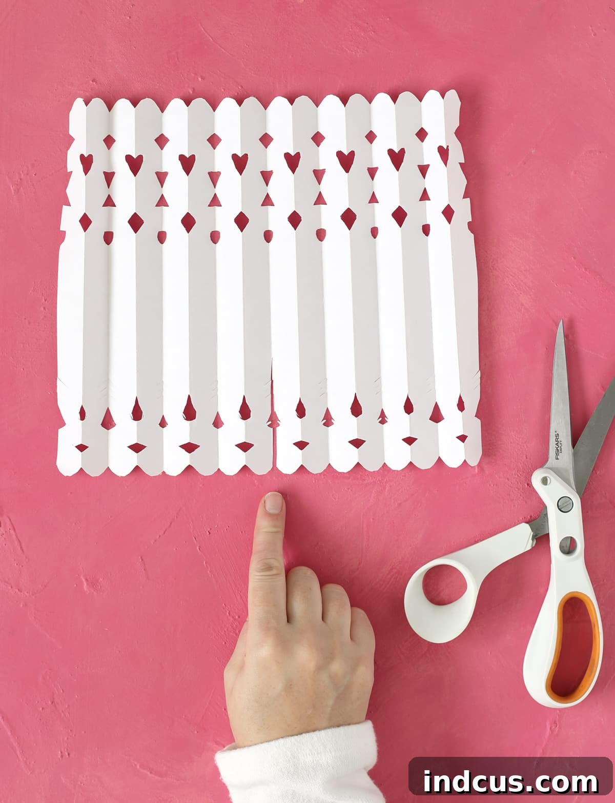 Detailed guide on how to cut a slit for forming paper Christmas angel wings