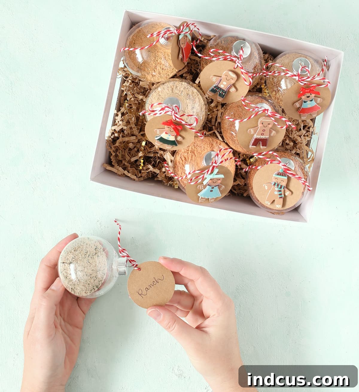 dip mix in clear christmas ornaments with attached kraft paper tags