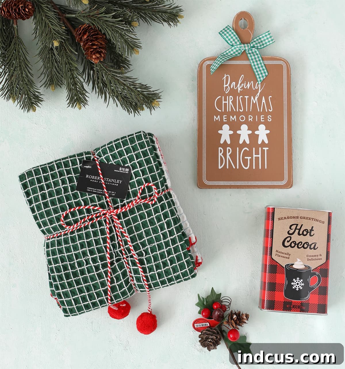 kitchen themed christmas gift with printable tag including a metal hot cocoa tin and festive towels