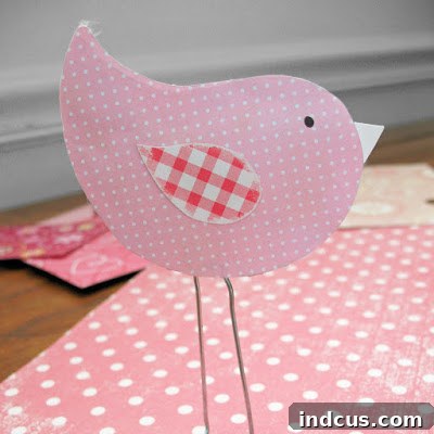 Paper clip love birds made with scrapbook paper for Valentine's Day