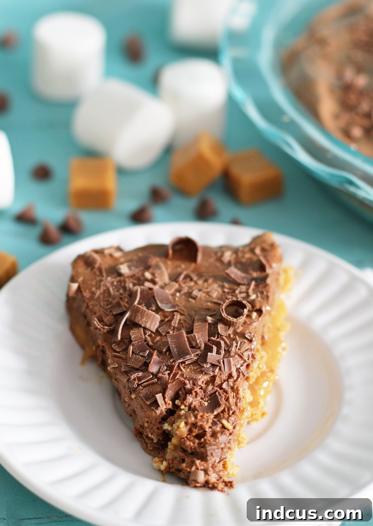 Stunning chocolate caramel marshmallow pie, perfectly set and garnished, ready to be served at a special occasion