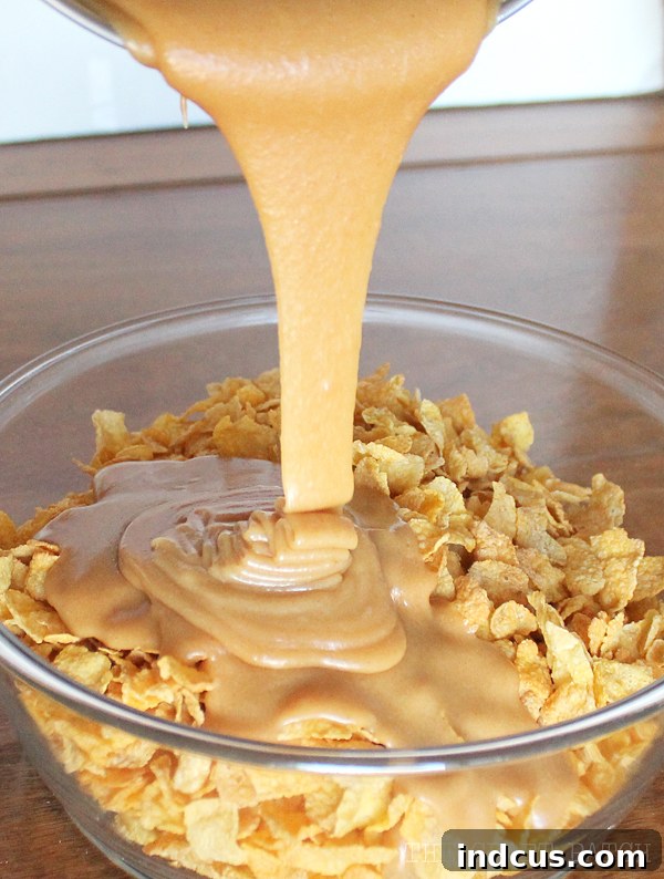 These no-bake cornflake cookies are made with sweet peanut butter and crunchy cereal. You will love this family favorite treat recipe Sweet and crunchy Cornflake Cookies on wax paper
