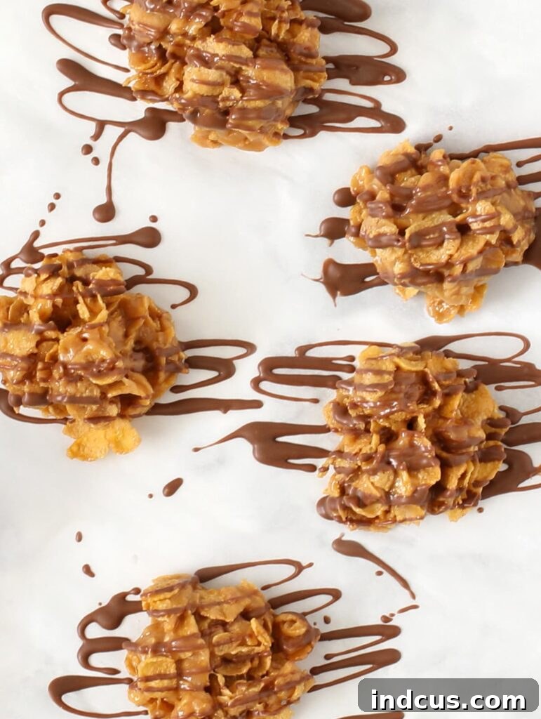 Crunchy Cornflake Delights 4 No-bake chocolate drizzled cornflake cookies ready to eat