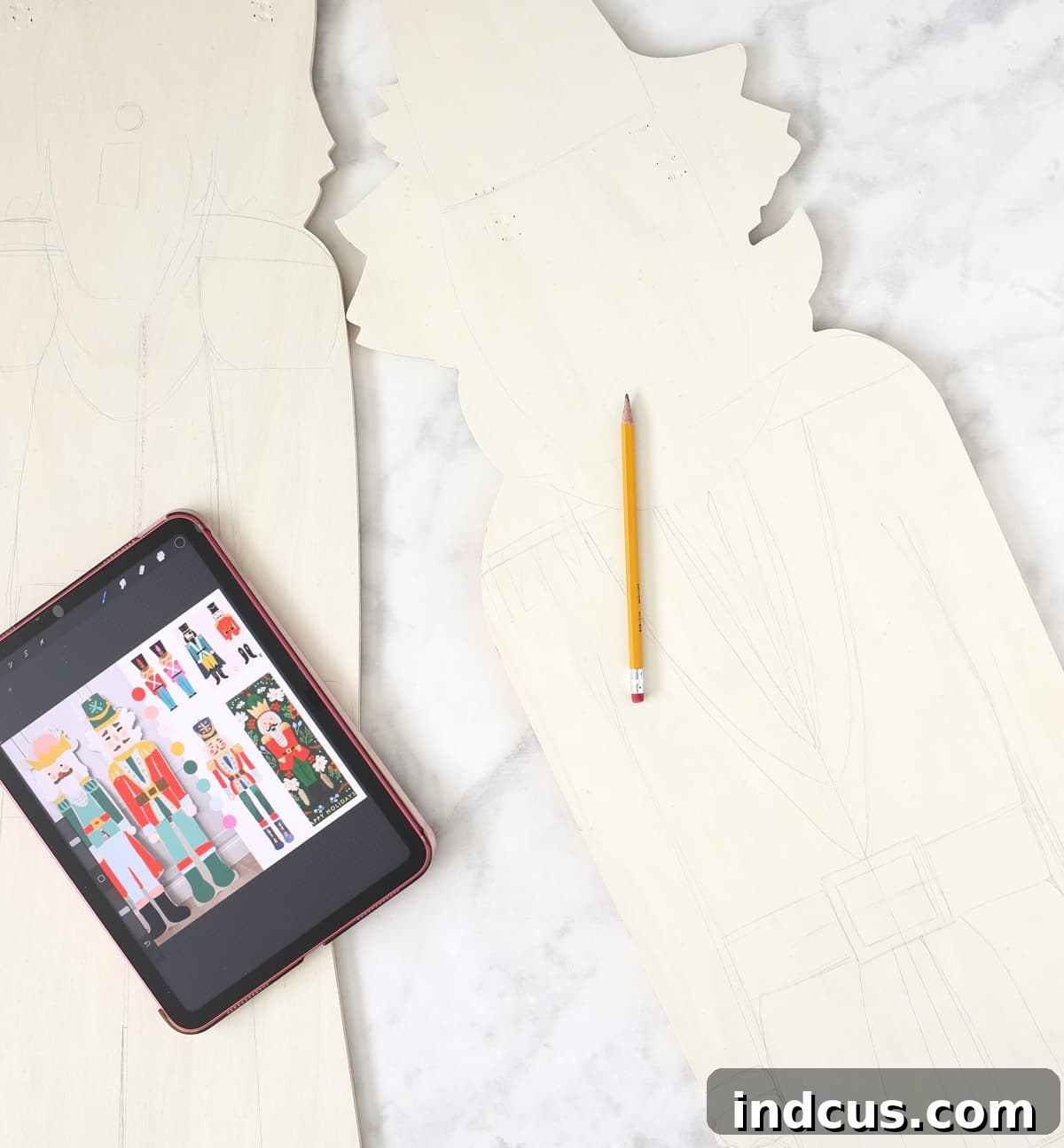 refer to an image while sketching designs on wood