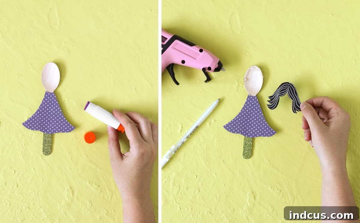 Gluing paper dress, hair, and hat pieces onto a wooden spoon witch