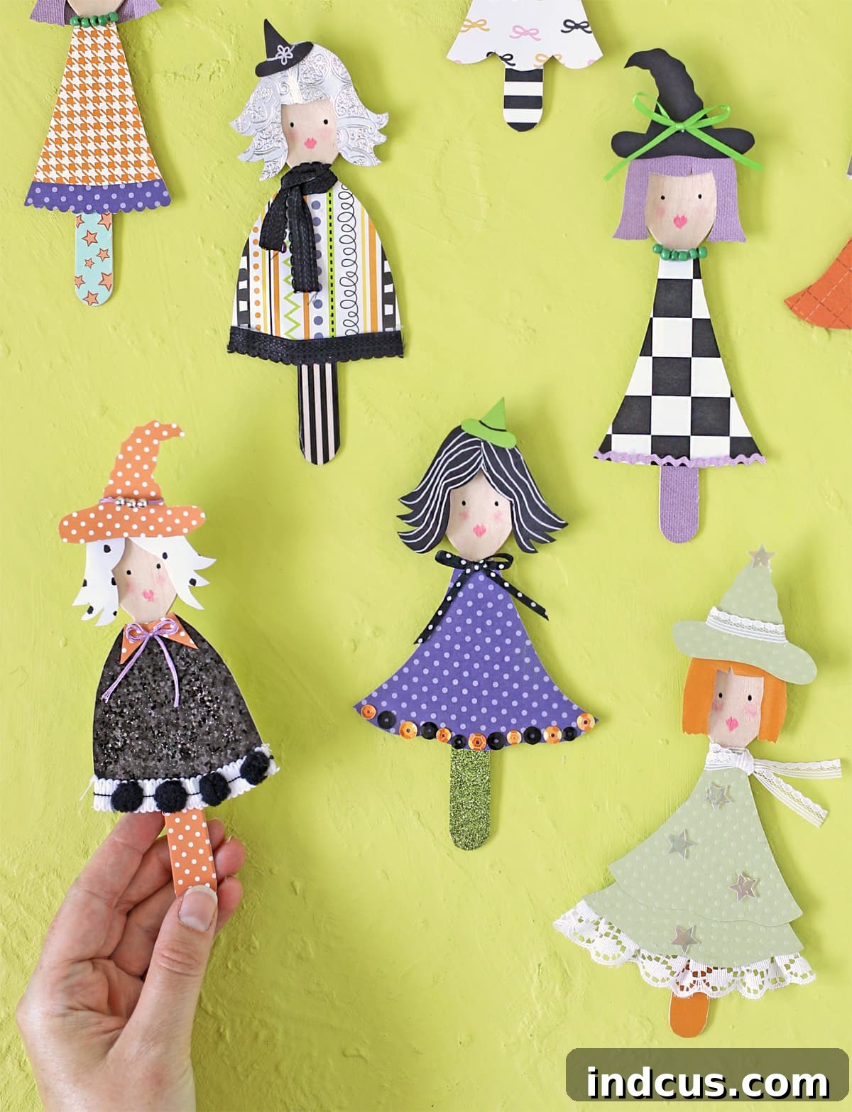 Collection of finished Halloween wooden spoon witches, showcasing various designs