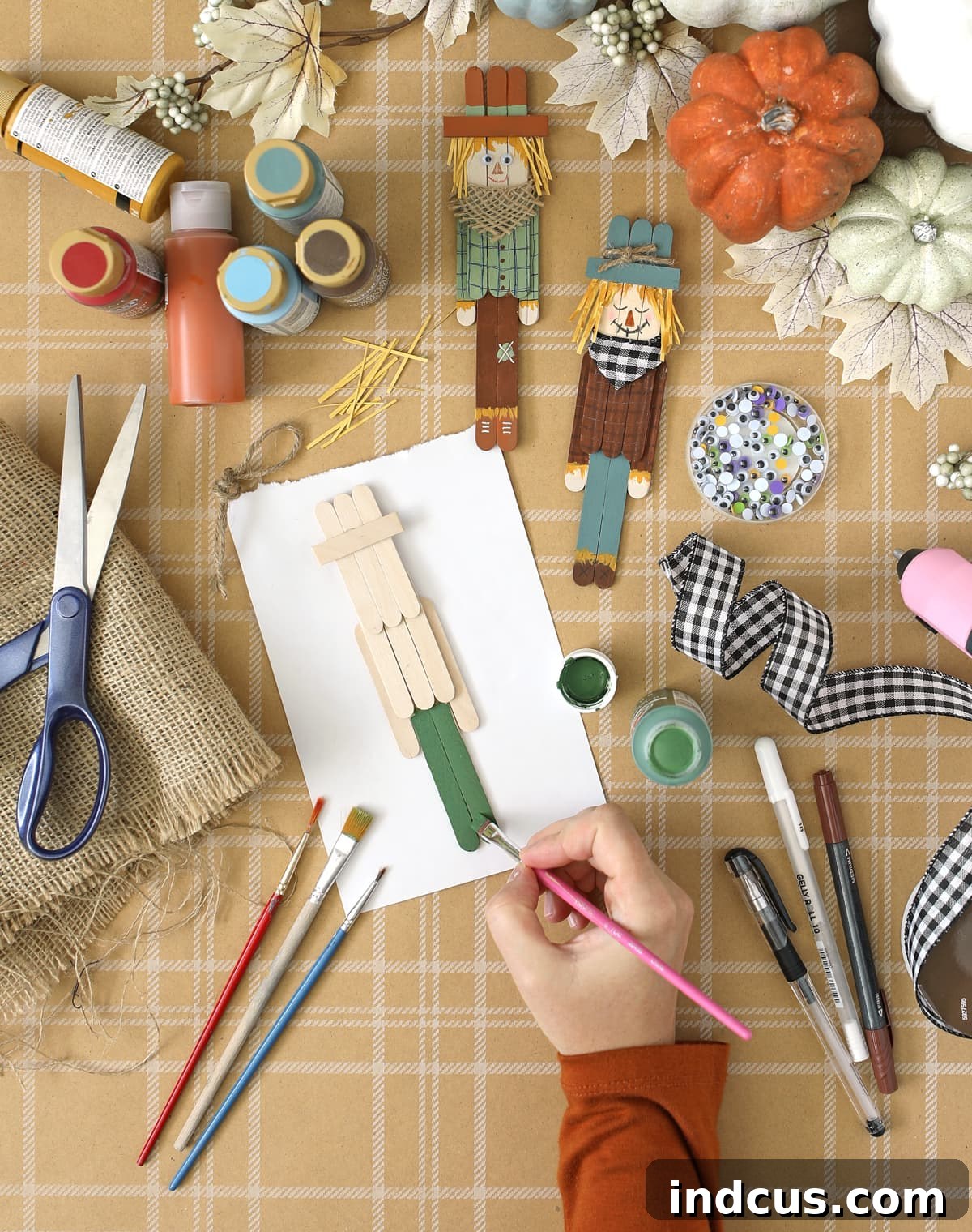 Step-by-step painting process for craft stick scarecrows
