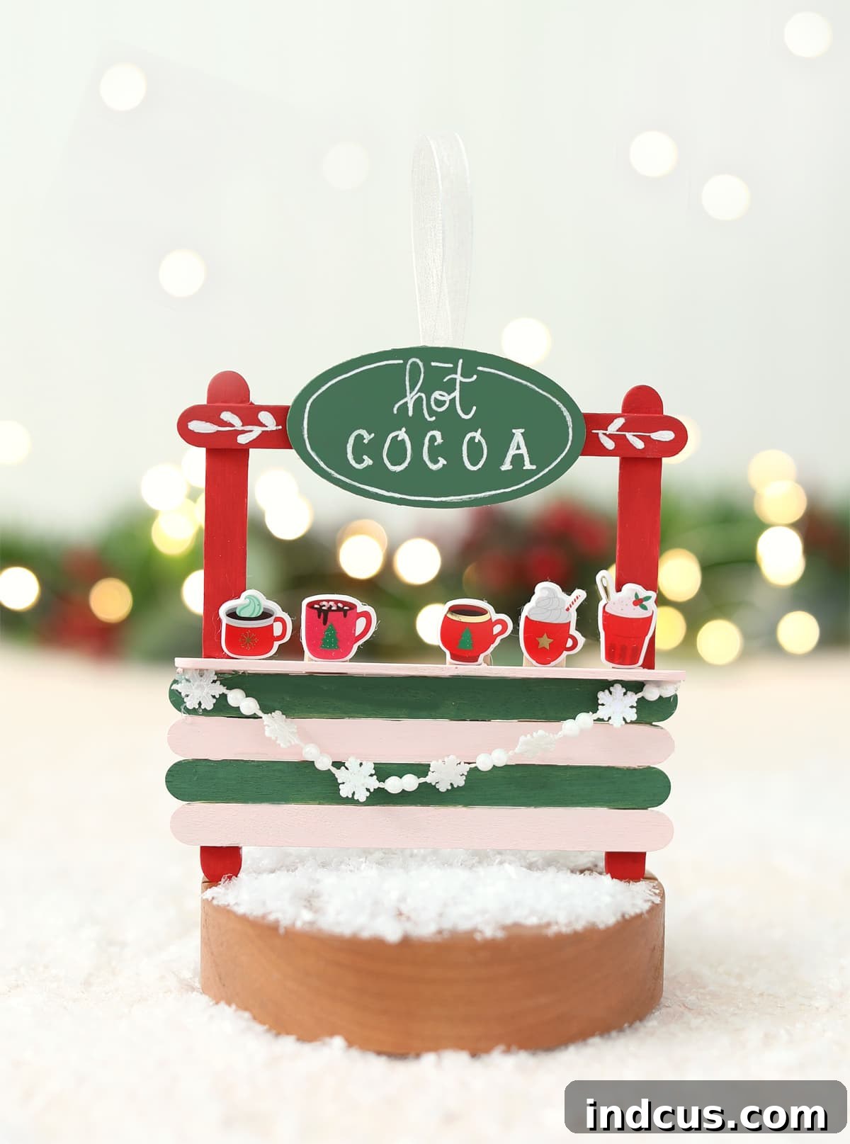 A cozy hot cocoa station popsicle stick Christmas ornament