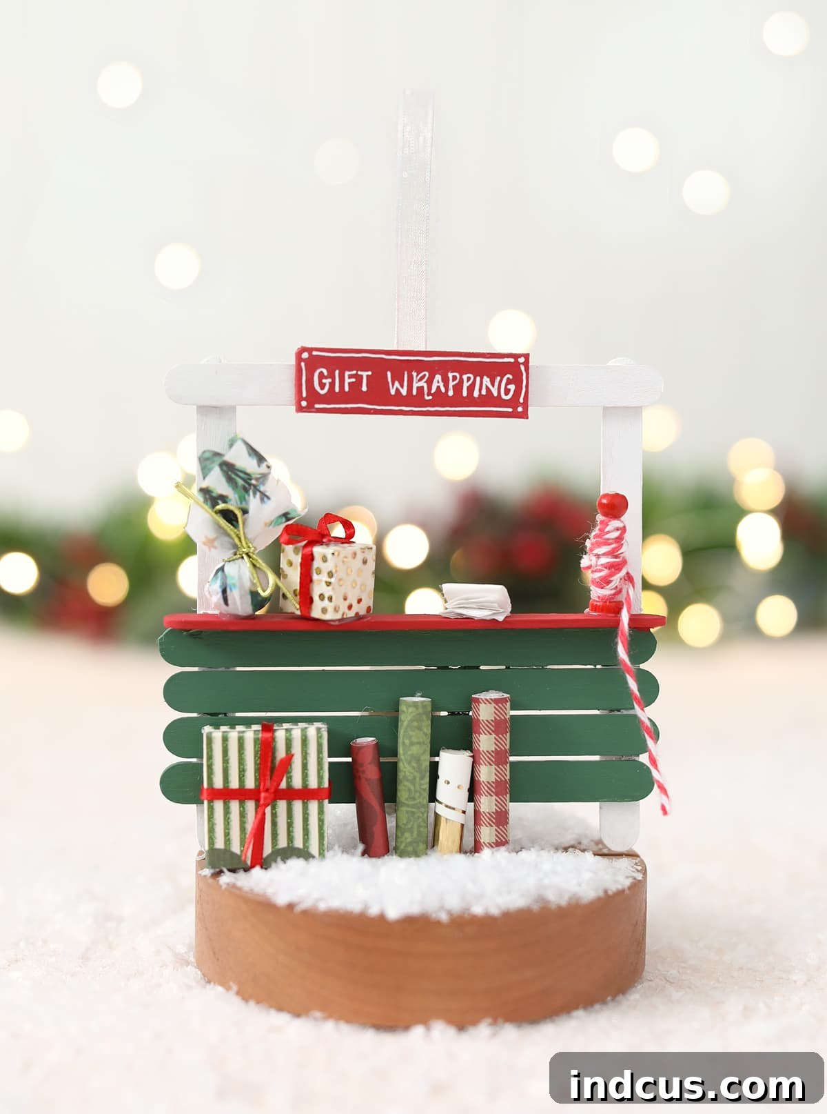 An elaborate gift wrapping station popsicle stick Christmas ornament