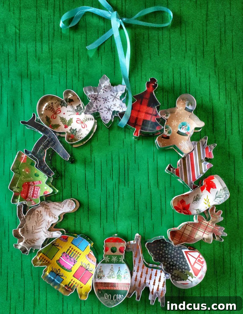 Whimsical Christmas cookie cutter wreath with patterned paper