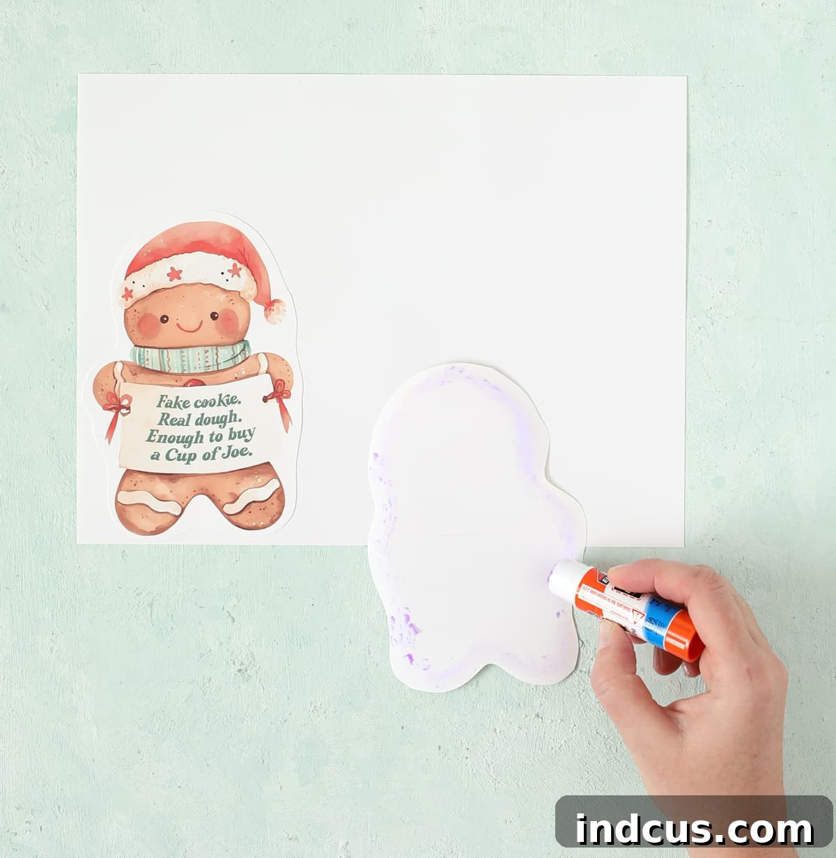 Glue the gingerbread cutout onto a second piece of cardstock