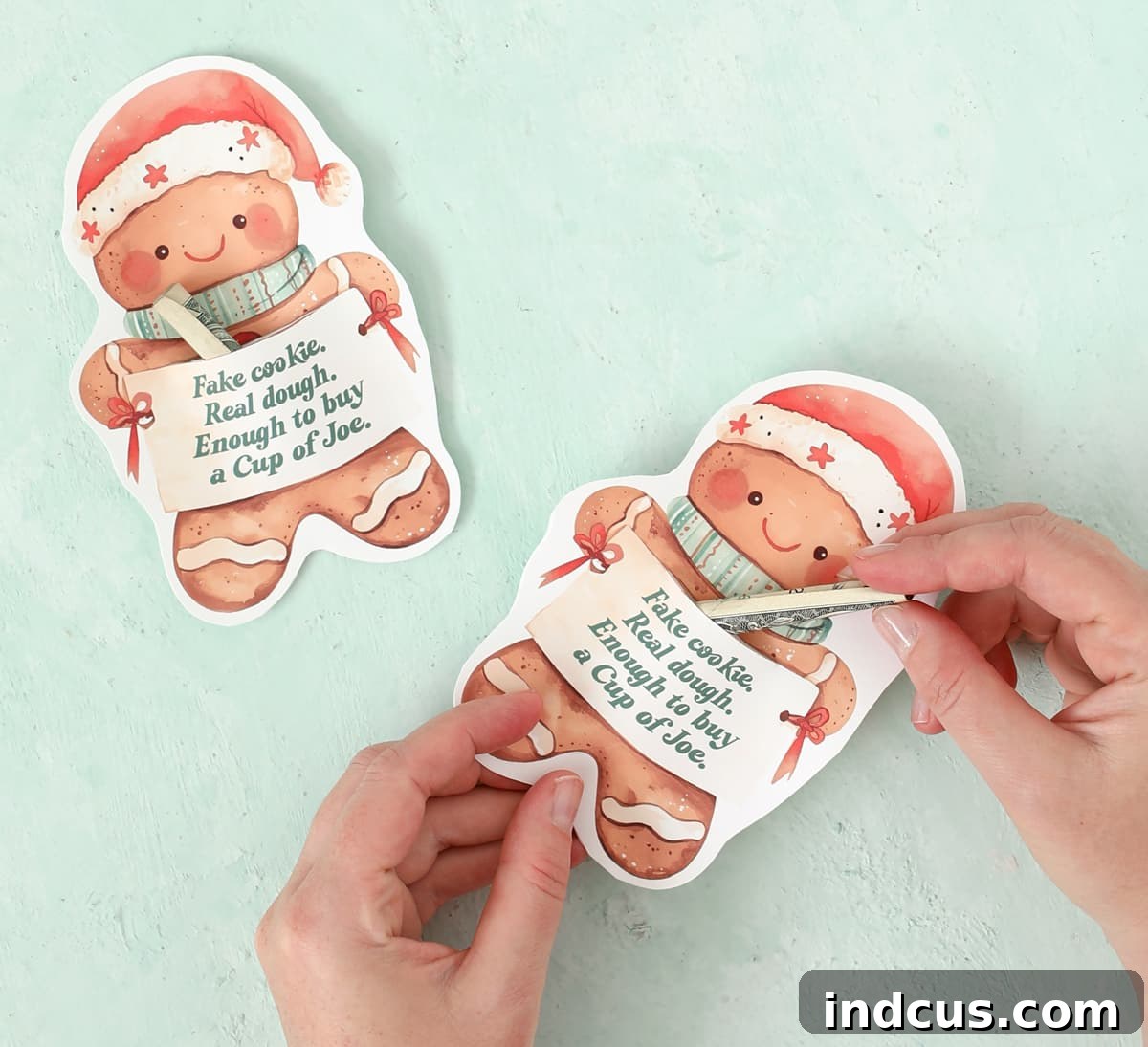 Insert rolled money bill into the gingerbread cookie money gift holder