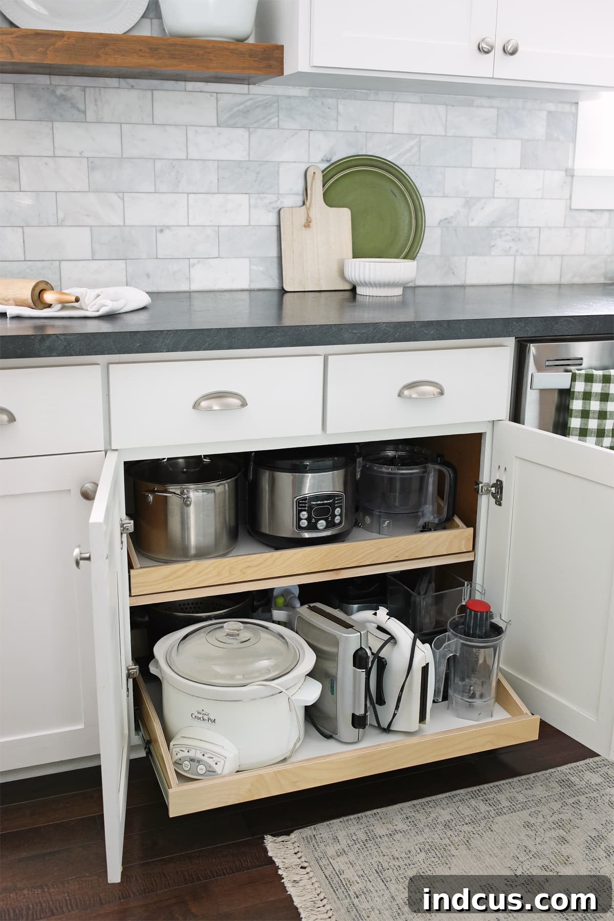 Organized kitchen cabinet with DIY pull out drawers holding small appliances