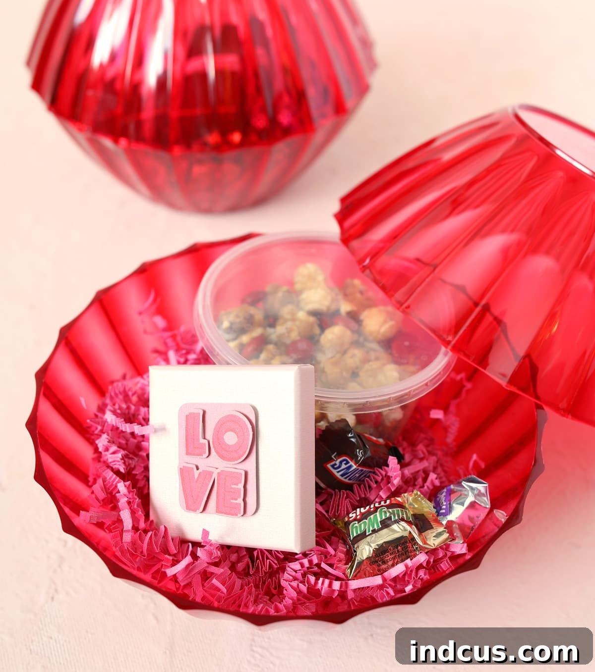 Mega Cherry Love Gift 4 Filling red plastic bowls with Valentine's Day presents and paper shreds