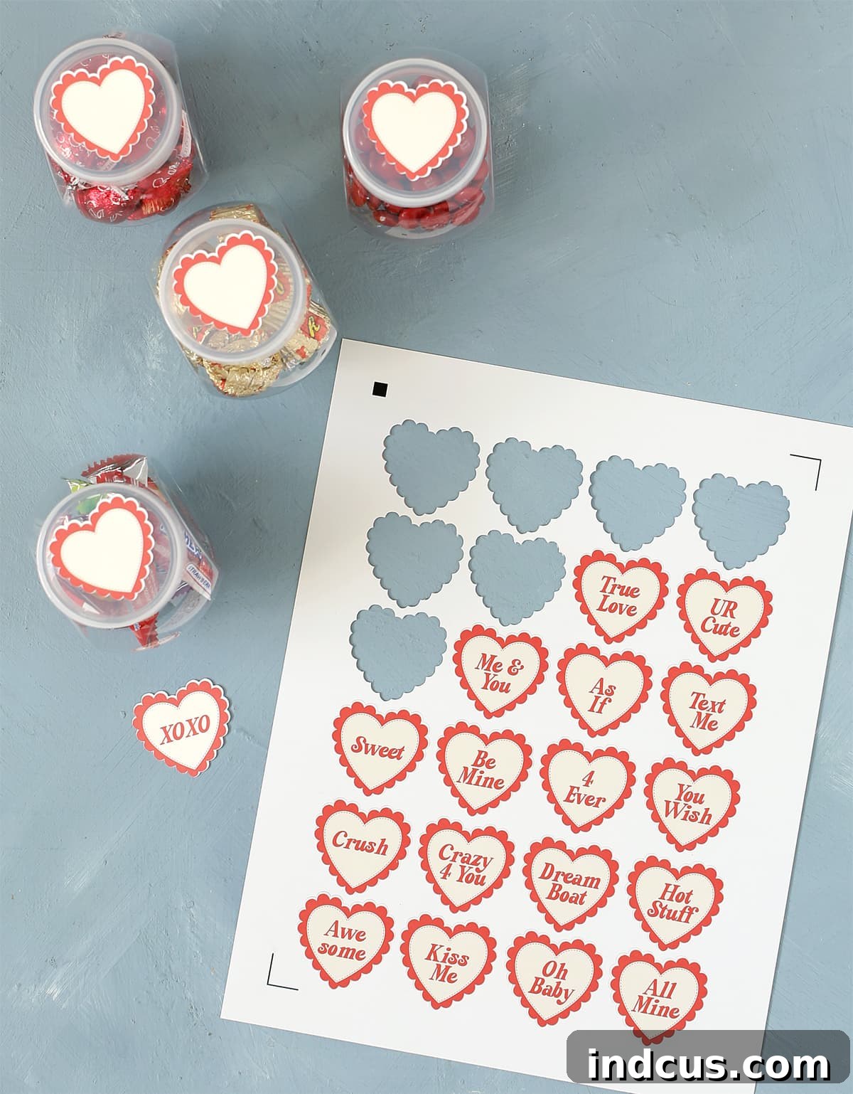 Printable heart labels for candy jar lids, adding a cute touch to the display.