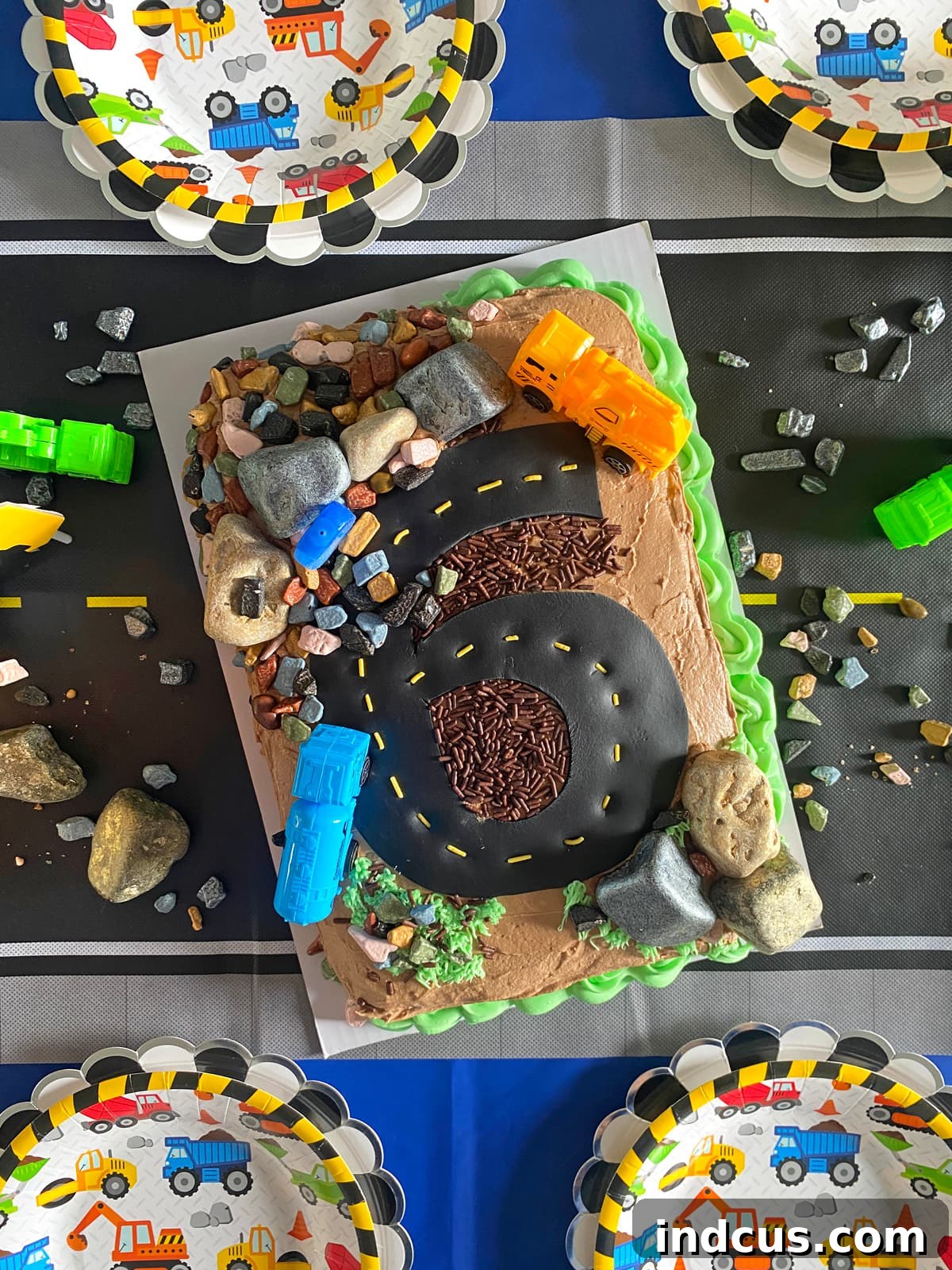 Building a Birthday Bash 9 Detailed close-up of the construction themed birthday cake, highlighting the fondant road and chocolate avalanche