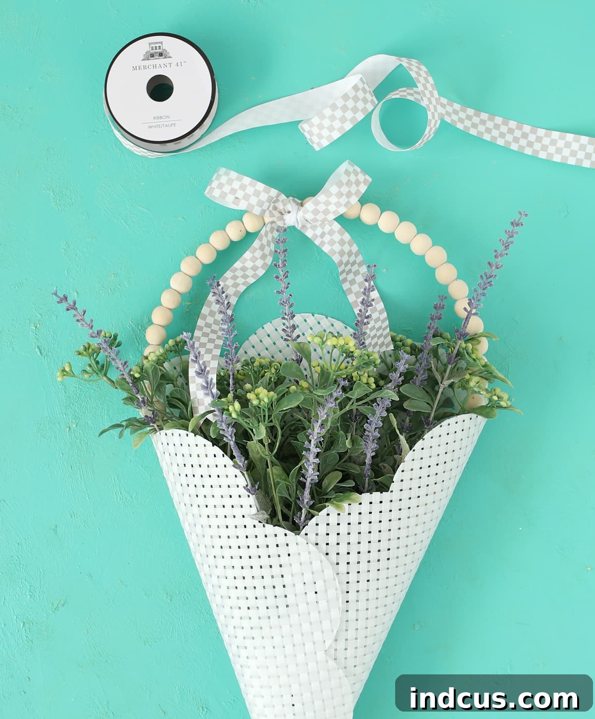 Finished DIY door basket craft with a decorative bow