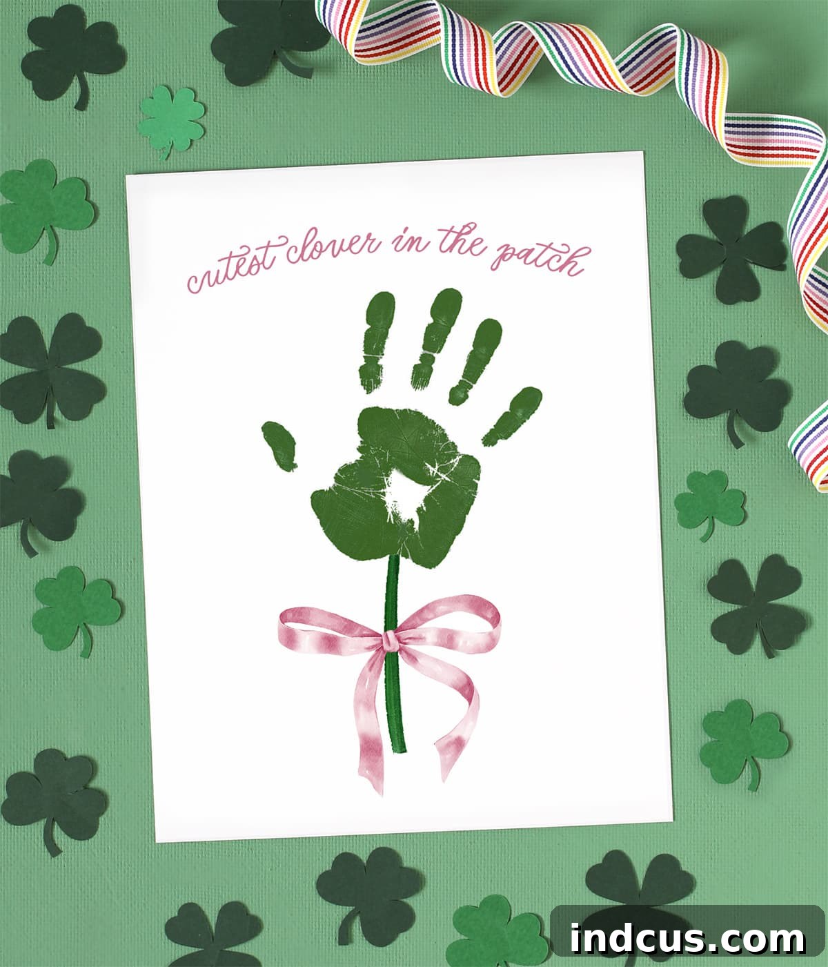 Adorable St. Patrick's Day handprint craft featuring a clover design