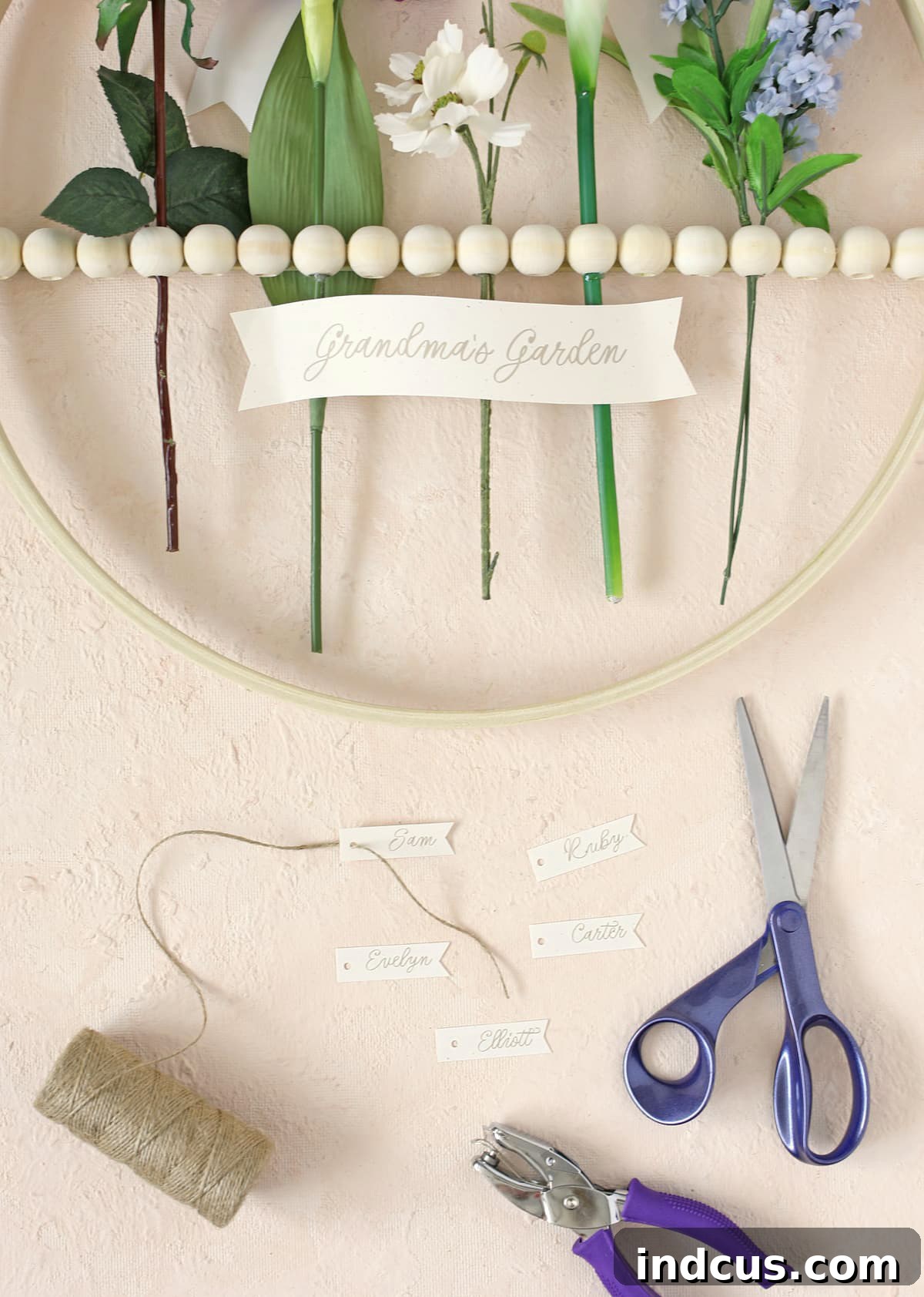 add names to birth flowers on DIY wall hanging