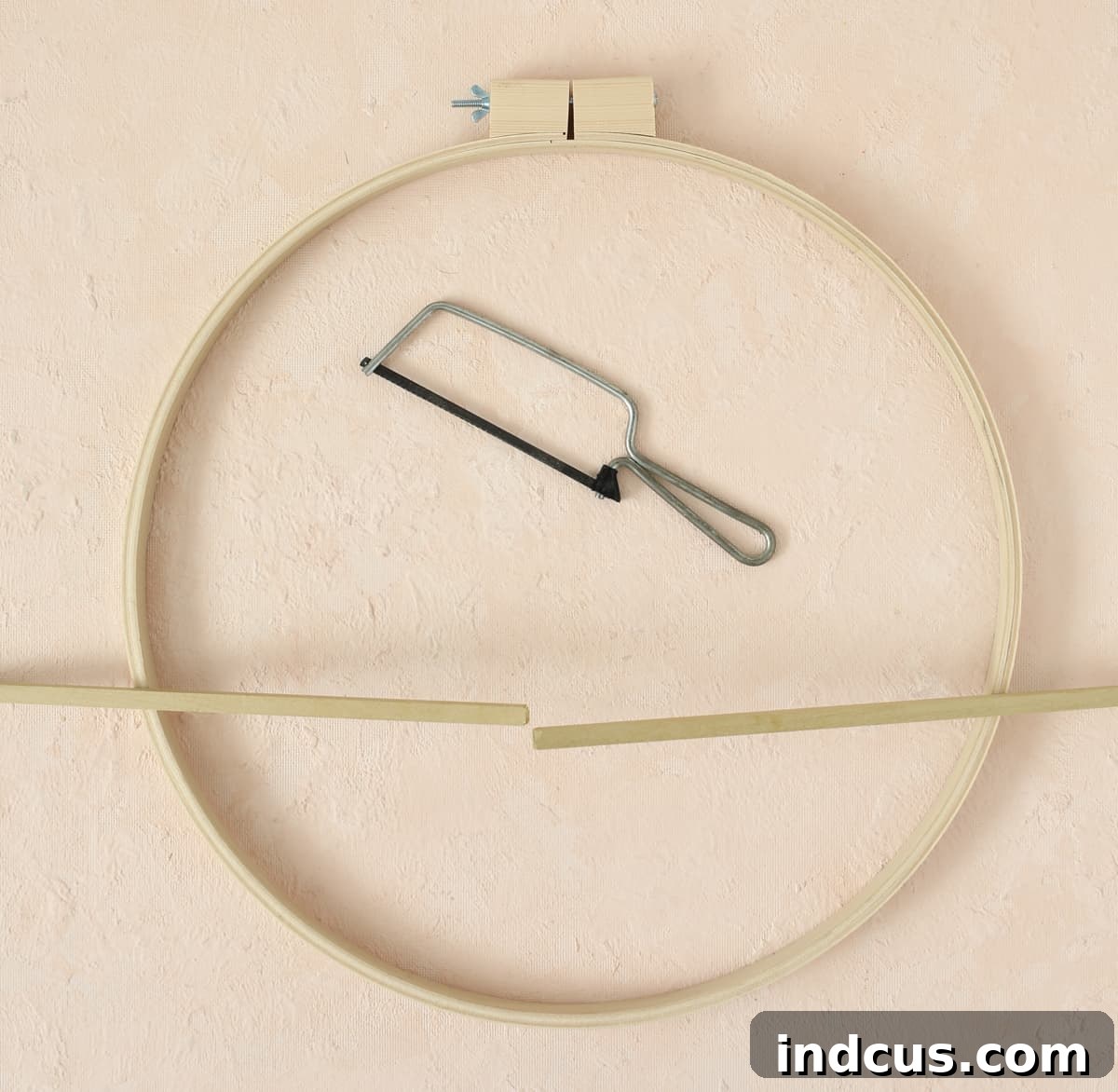 cut dowel to size for DIY floral hoop