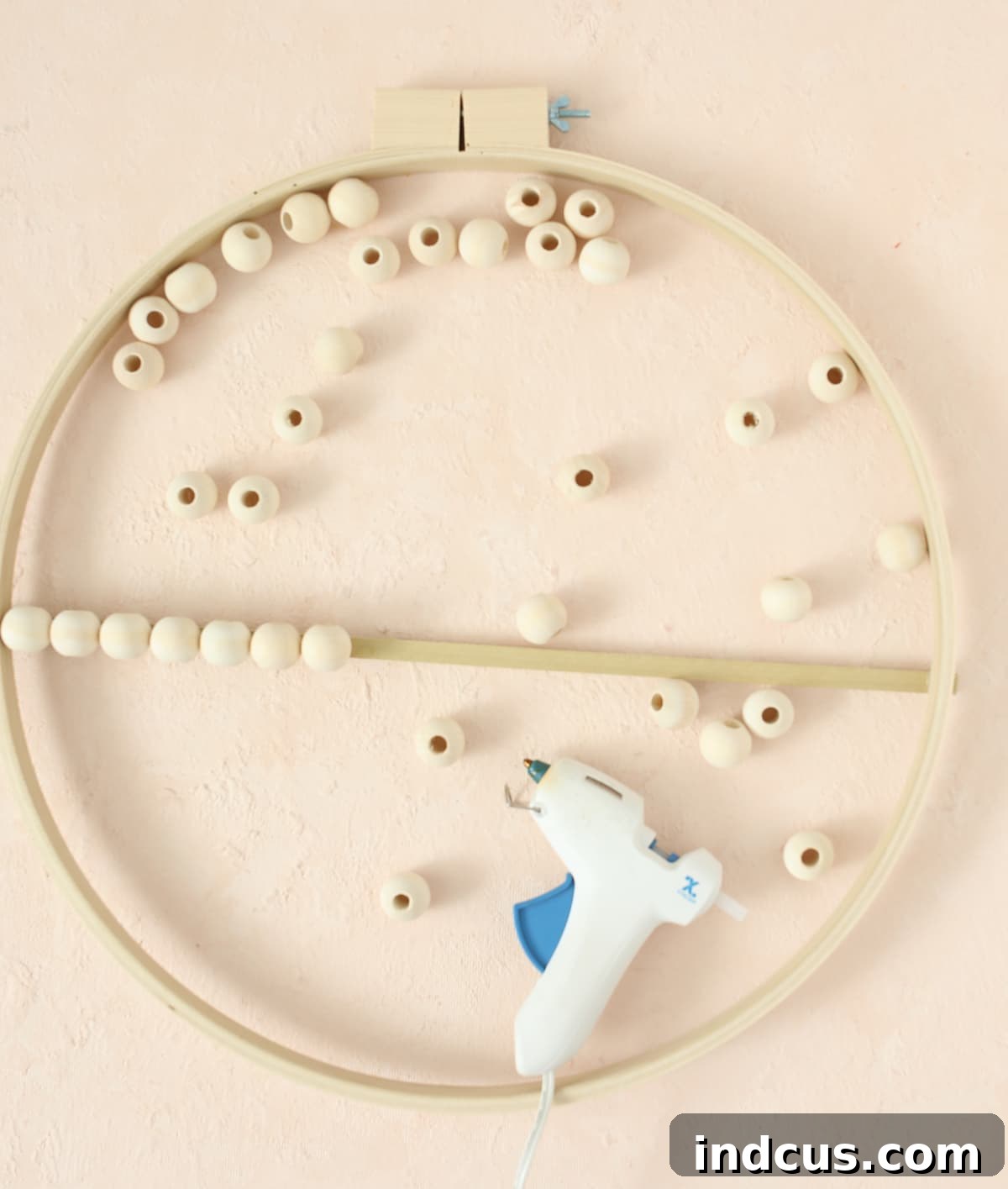 glue wood beads to dowel for floral craft
