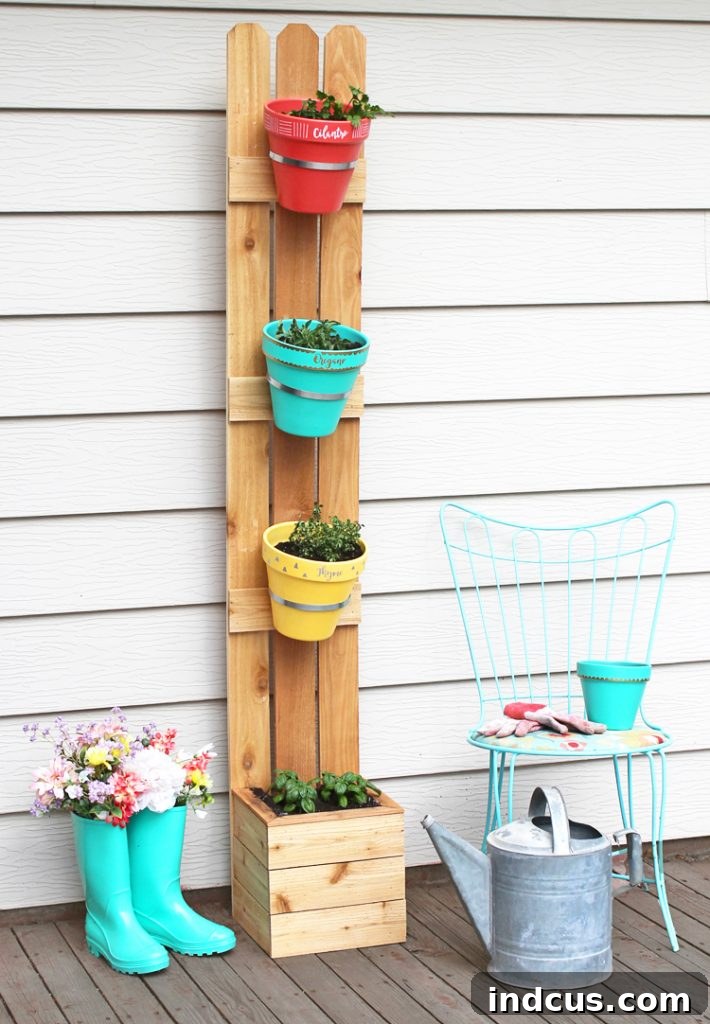 A charming DIY vertical planter made with cedar fence pickets and colorful terracotta pots, offering a rustic yet modern aesthetic.
