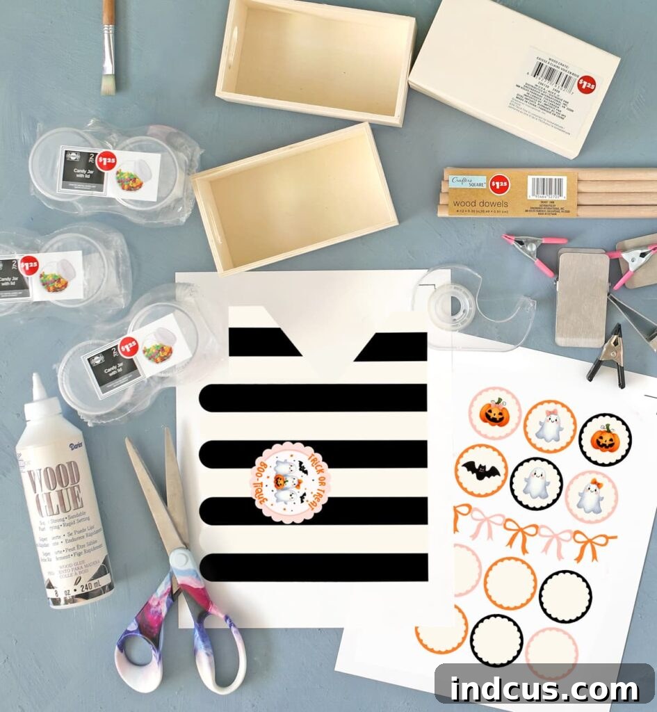 DIY Spooky Candy Shop 3 Craft supplies laid out for making a Dollar Tree mini Halloween candy shop, including wooden crates, dowels, and small candy jars
