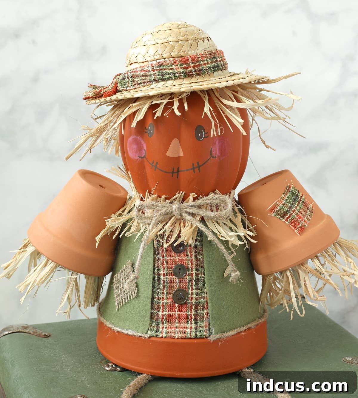 Craft Your Own Clay Pot Scarecrow 9 Completed terracotta pot scarecrow craft with hat and decorations