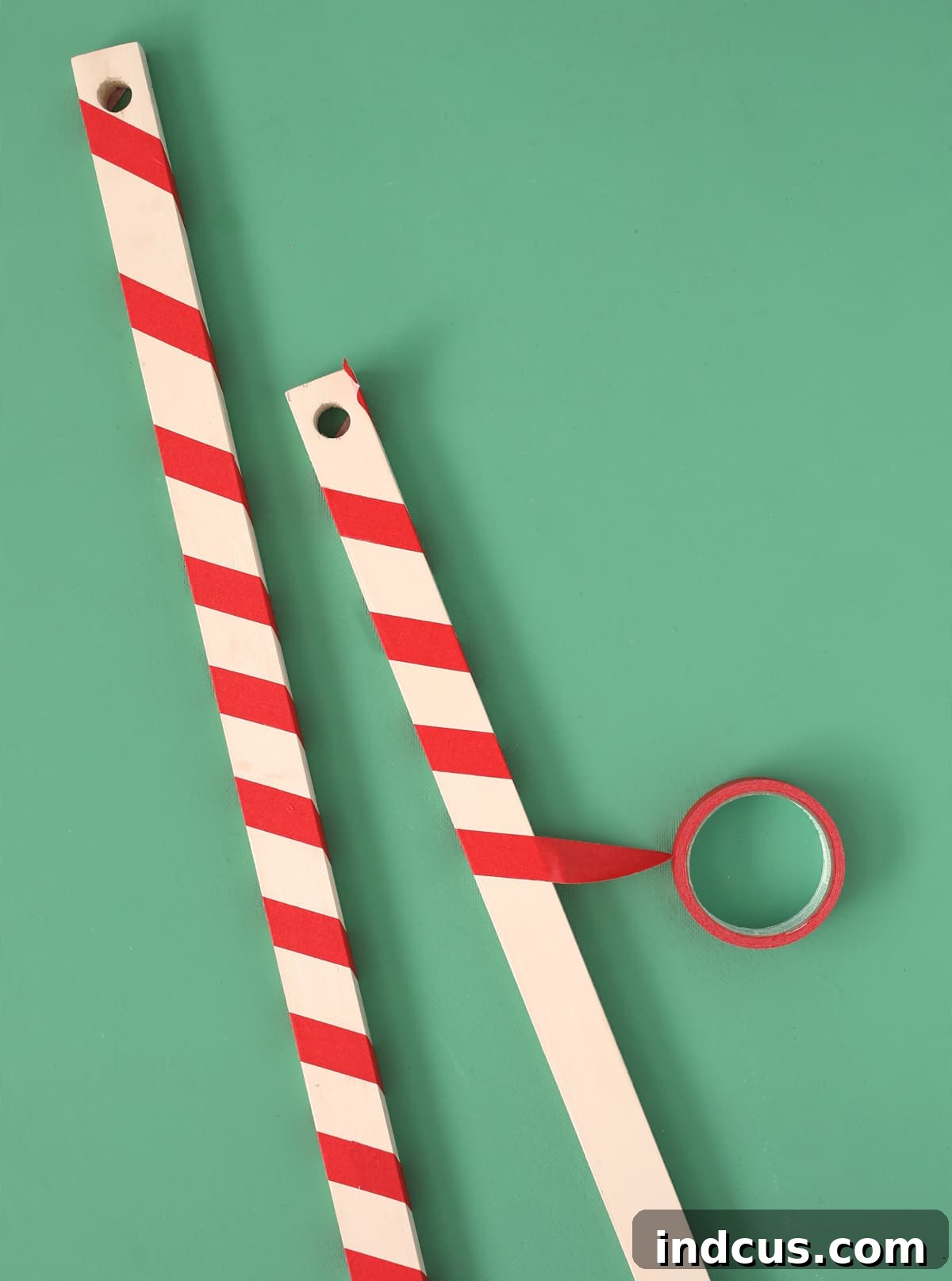 wrap boards in masking tape to look like candy canes for a festive play tent