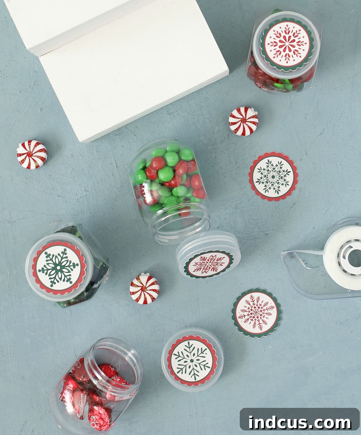 Sweet Christmas Shop Project 8 Close-up of candy jar lids adorned with festive Christmas accessories for the miniature shop