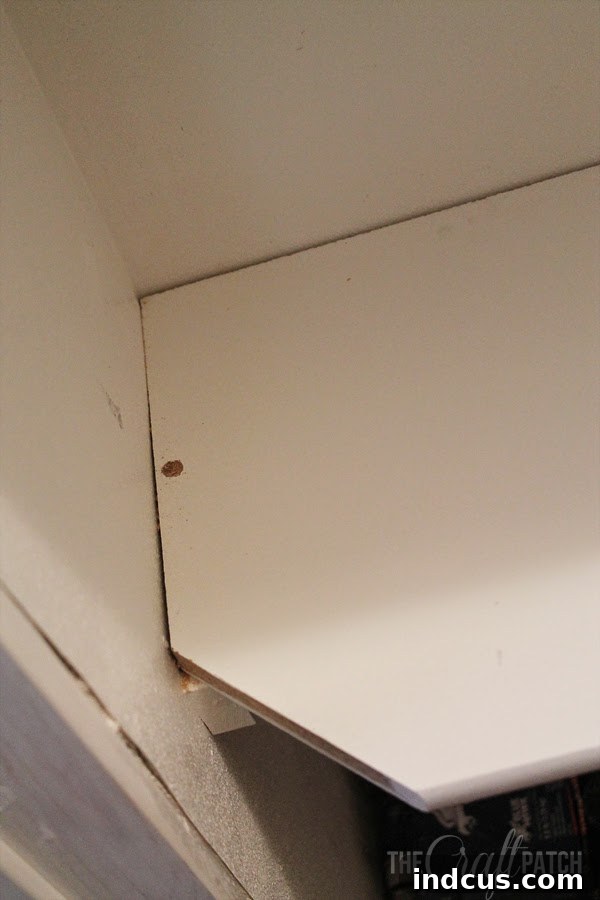 Pantry storage shelves after caulking and filling