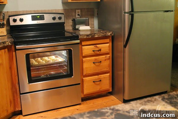 Fresh Coat, Fresh Life: Appliance Update 4 New appliances and painted fridge at night, showing kitchen ambiance