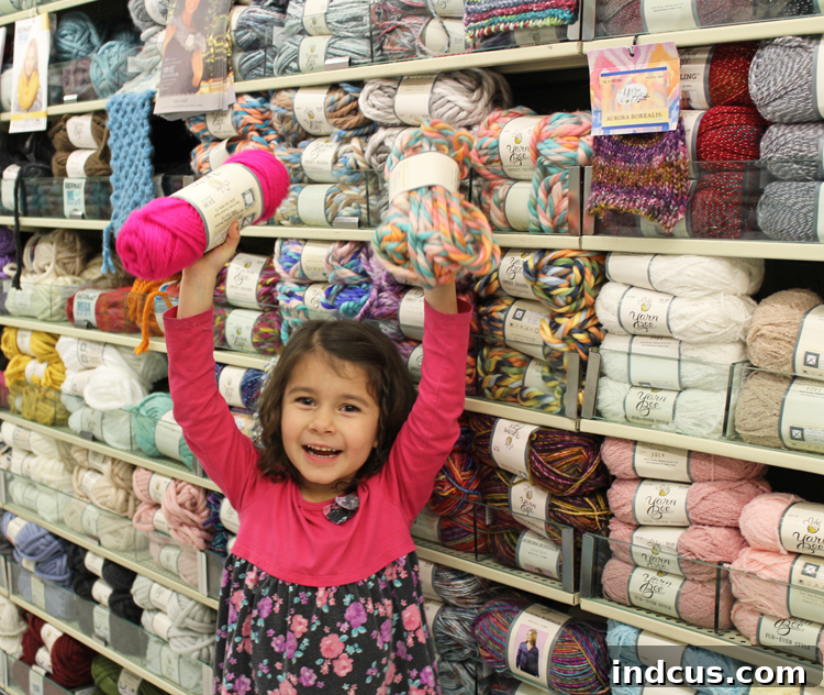A wide and inspiring yarn aisle at Hobby Lobby, featuring diverse colors and textures