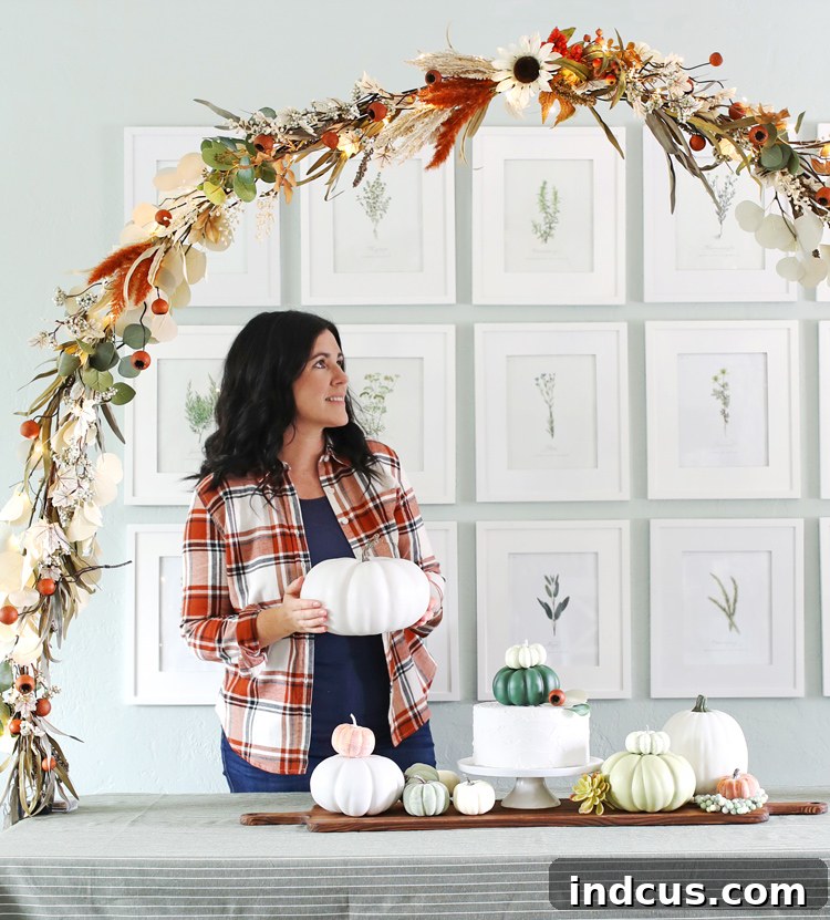 A festive fall floral party arch created using Hobby Lobby floral bunches