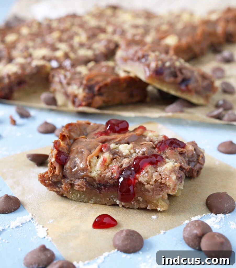 Exquisite chocolate raspberry crumb bars with a golden shortbread crust