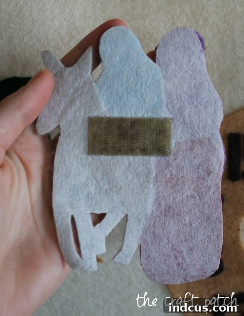 Close-up of Mary, Joseph, and donkey figures with velcro on back for the advent calendar
