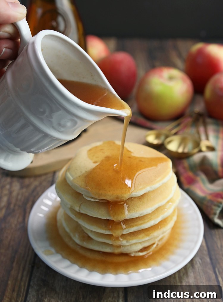 Autumn Apple Nectar 2 Delicious homemade apple cider syrup drizzled over pancakes
