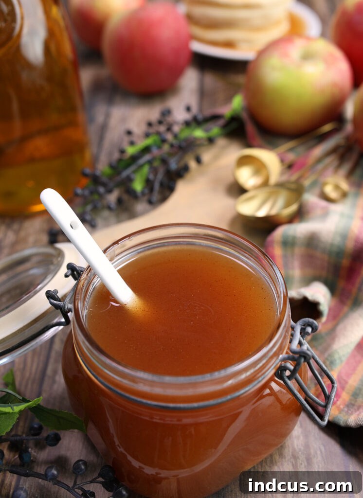 Autumn Apple Nectar 3 Homemade apple cider pancake syrup in a glass pitcher
