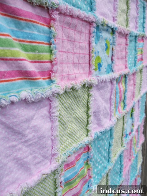 Close-up of fluffy frayed edges on a handmade rag quilt.