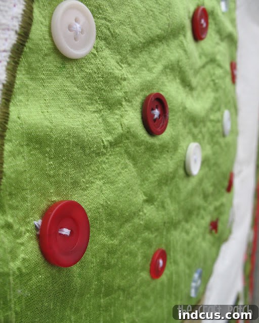 Cozy Felt Ornament Countdown 5 buttons sewn on an advent calendar to hold the ornaments