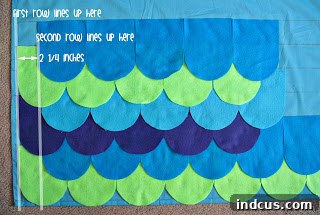 Arrange felt pieces in a chevron pattern on backing fabric
