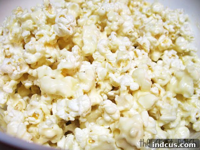 Pinterest Perfect Popcorn 5 A large bowl filled with appetizing gooey microwave marshmallow popcorn, ready to serve
