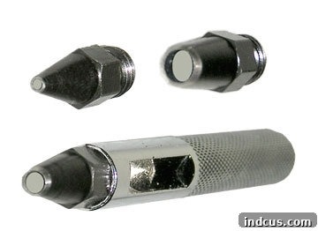 Detail of a hand-held tool for punching holes in cardboard, useful for crafts
