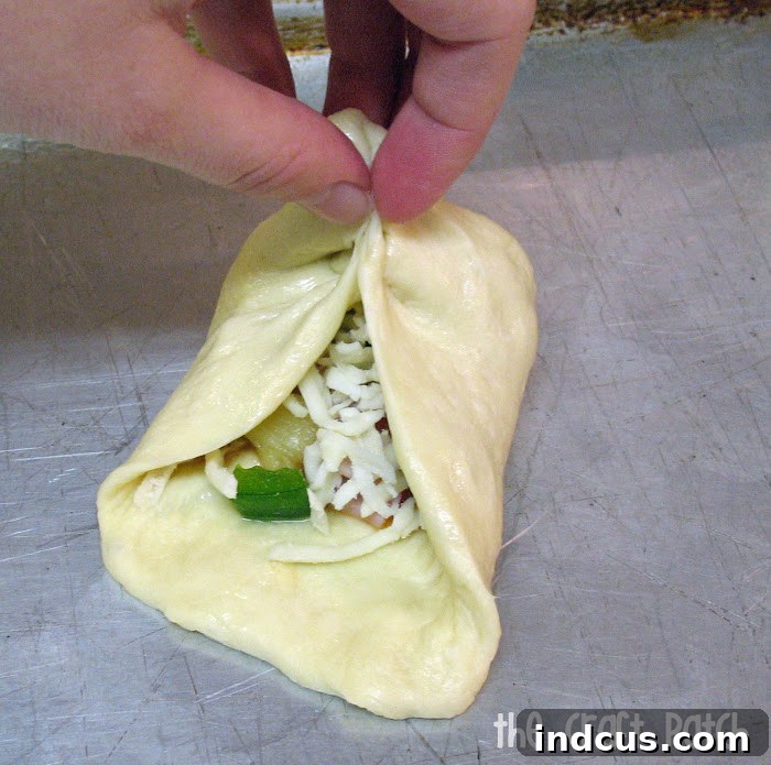 Sealing the stuffed dinner roll