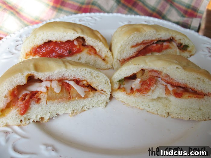 Baked stuffed dinner rolls cut open