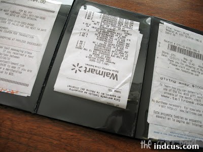 repurpose a photo album to hold receipts