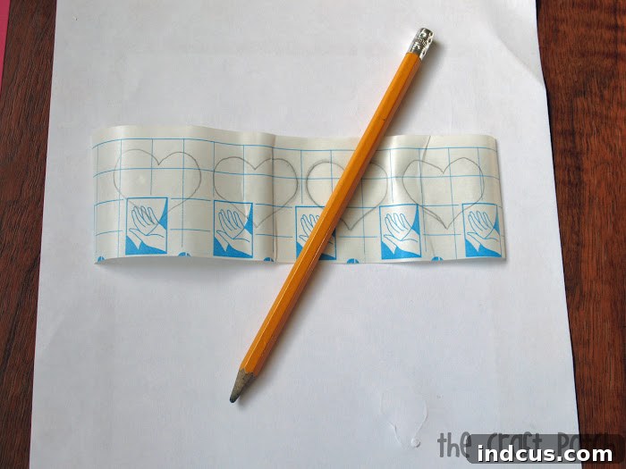 tracing shapes onto contact paper for scratch cards