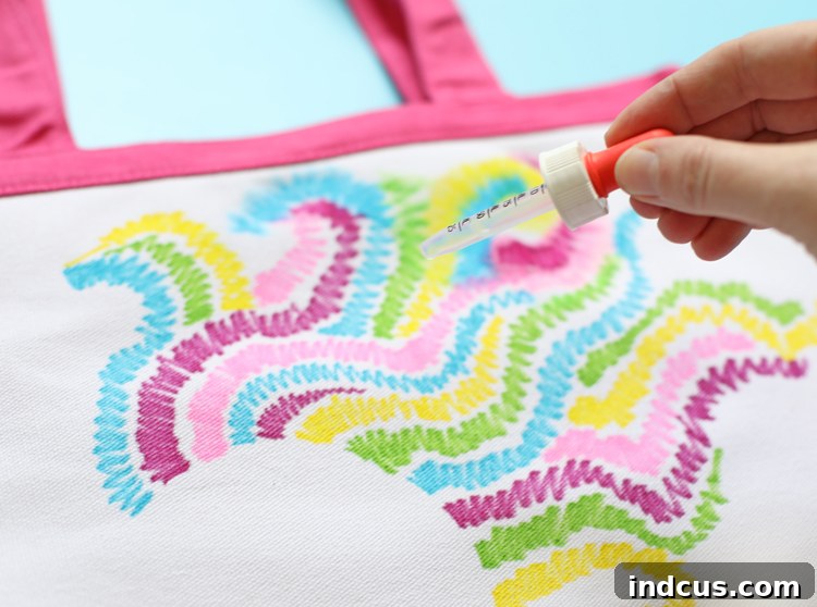Applying Rubbing Alcohol to Sharpie Fabric Art with Dropper