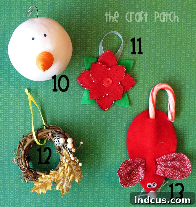 A close-up of a vibrant red felt poinsettia Christmas ornament.