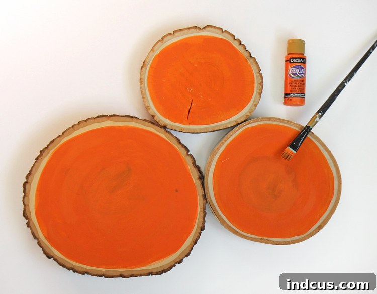 Painting Wood Slices Orange for Pumpkin Craft Base
